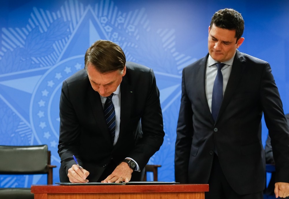 Presidente Jair Bolsonaro em evento no Palácio do Planalto, em junho, ao lado do ministro da Justiça. Sérgio Moro, que preside o Conselho Nacional de Políticas sobre Drogas